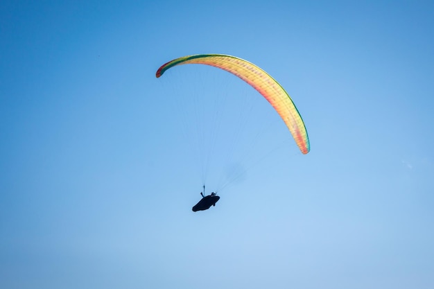 Paragliding flight in the mountains. Le Grand-Bornand, Haute-Savoie, France