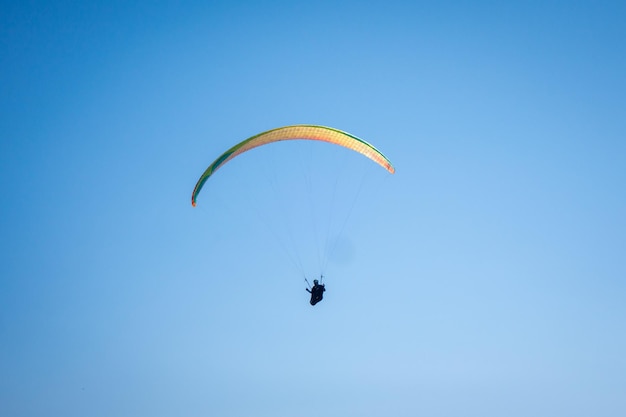 Paragliding flight in the mountains. Le Grand-Bornand, Haute-Savoie, France