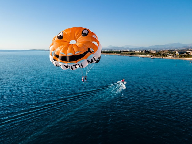 Parasailing in the clear blue sea at a luxury hotel resort the ultimate vacation experience