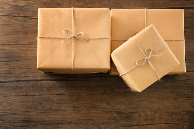 Parcel gift boxes on wooden table