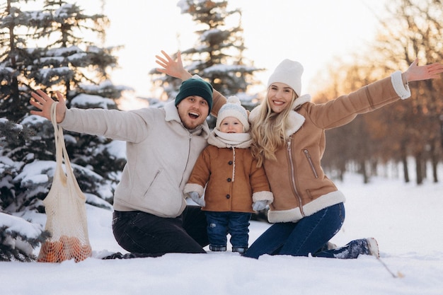 parent and child walking in winter park