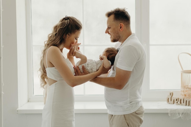 Parent holding baby happy family portrait happy family concept