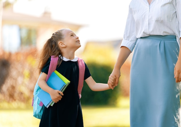 Parent and pupil going to school