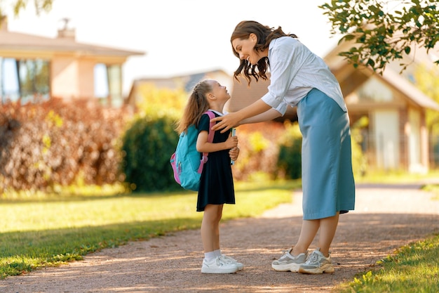 Parent and pupil going to school