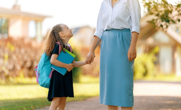 Parent and pupil going to school