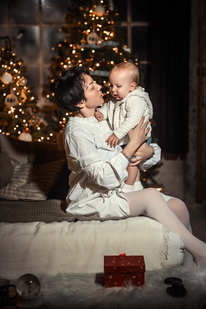 parent with child near christmas tree