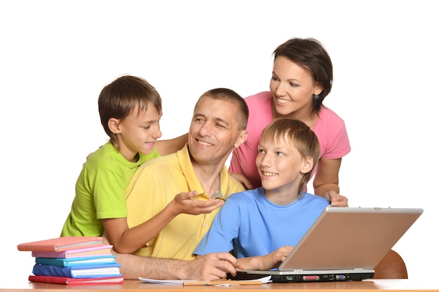 Parents helping boys with homework on a white background