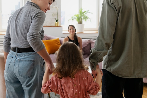 Parents and kid doing therapy