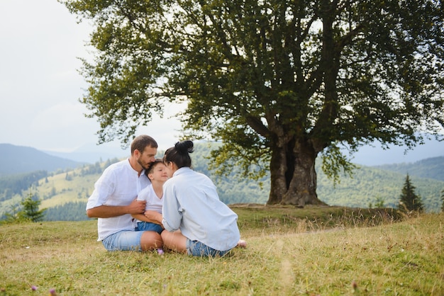 Parents and son relaxing in nature