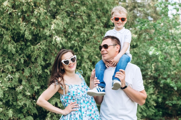 Parents and their little son in the park