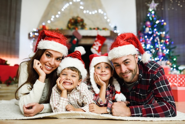 Parents with children laying on floor