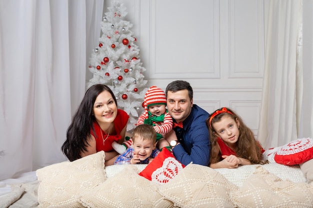 Parents with kids in a Christmas photo session