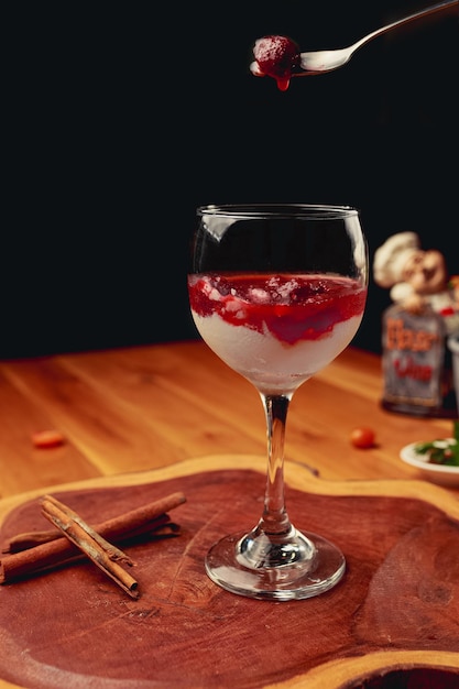 Parfait with yogurt jam and fresh fruit in the glass jar Healthy dessert or snac