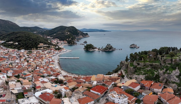 Parga city Greece Aerial drone view of the Castle ruins the traditional town building and the islands