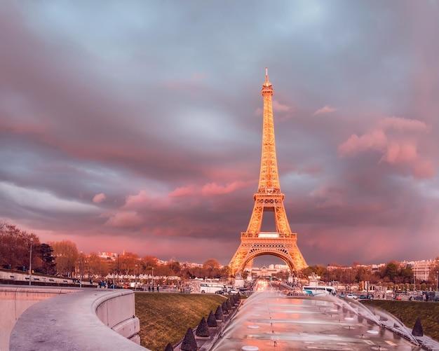 PARIS, FRANCE - APRIL 21 2016: The Eiffel tower on a sunset. The Eiffel tower is a famous monument located on the bank of the Seine river in Paris, France. This image is toned.