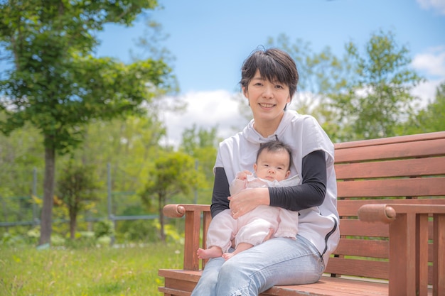 Park bench and parent and child