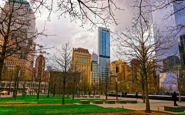 Park and Skyline with Skyscrapers in Financial Center at Lower Manhattan, New York City, America. USA. American architecture building. Panorama of Metropolis NYC. Metropolitan Cityscape