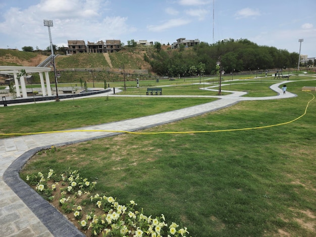 Photo a park with a bench and a sign that says  the park