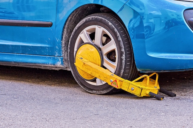 Parked car with an immobilizer tire lock of illegally