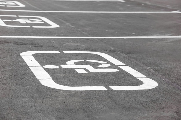 A parking lot with a handicap sign on it