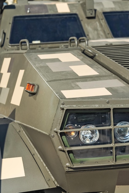 Part of an armored car painted in khaki Military equipment and ammunition