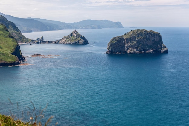 Part of Bay of Biscay with 2 little islets Gaztelugatxe and Aketx Bermeo Basque Country Spain