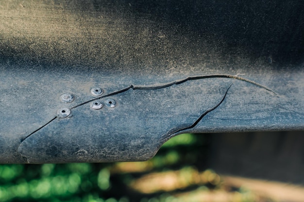 Part of the broken bumper of the car Selfrepair Selective focus