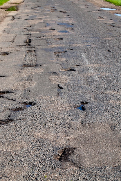 Part of the carriageway for cars with damage