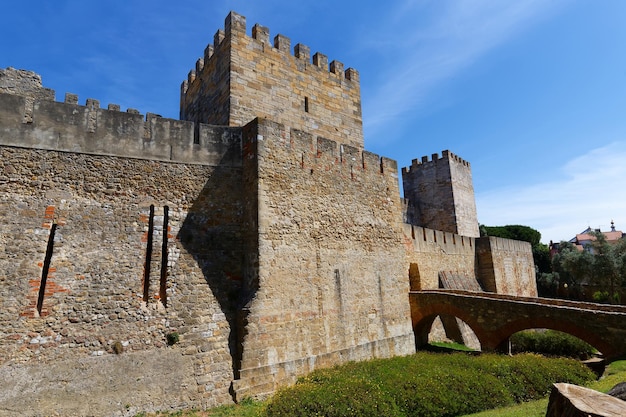 Part of the high stone masonry defense wall of the 11thcentury hilltop Moorish Saint George castle or Castelo de S Jorge Lisbon Portugal