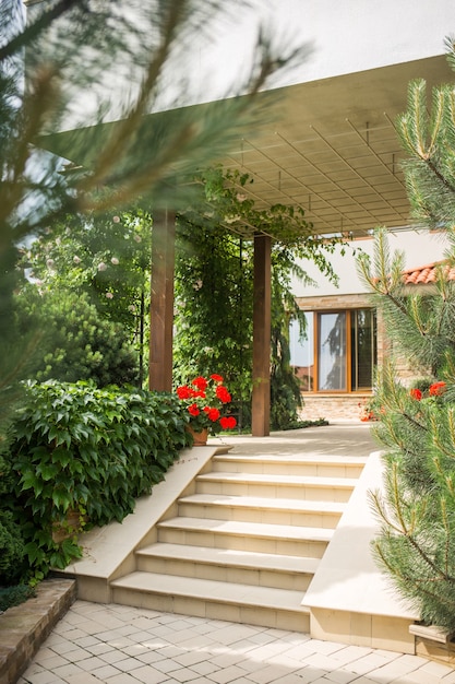 Part of the house against the sky overlooking the garden and well-kept territory