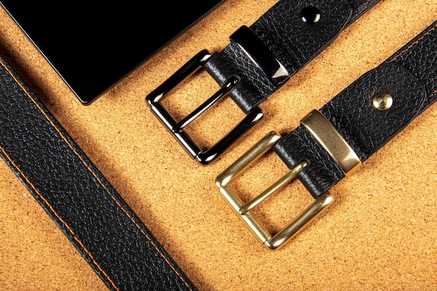 Part of leather belts with metal buckles