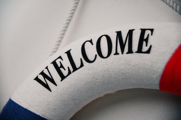 part of a lifebuoy closeup with the inscription welcome