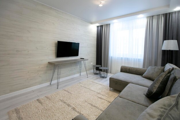 Part of the living room with sofa and TV Apartment design in natural colors