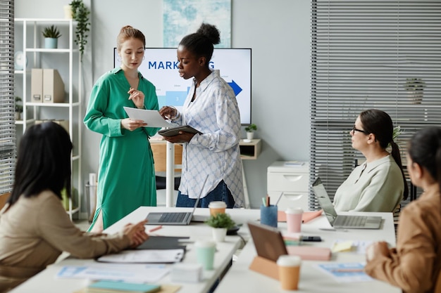 Partners analyzing situation at business presentation