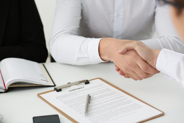 Partnership agreement between businesspeople celebrate with handshake