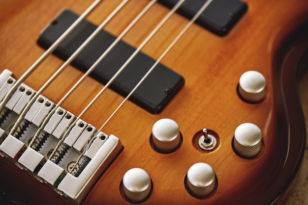 Parts of electric guitar close up view of electric guitar body with volume and tone