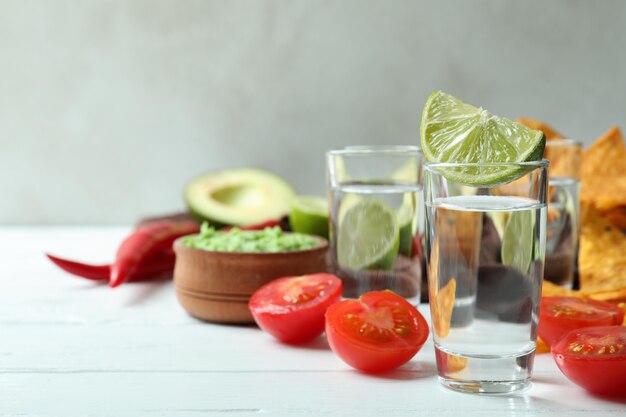 Photo party concept with tequila, guacamole and chips