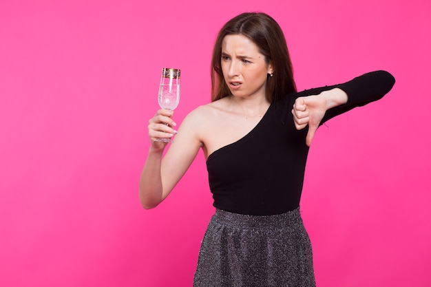 party drinks holidays christmas and people concept smiling woman in evening dress with glass