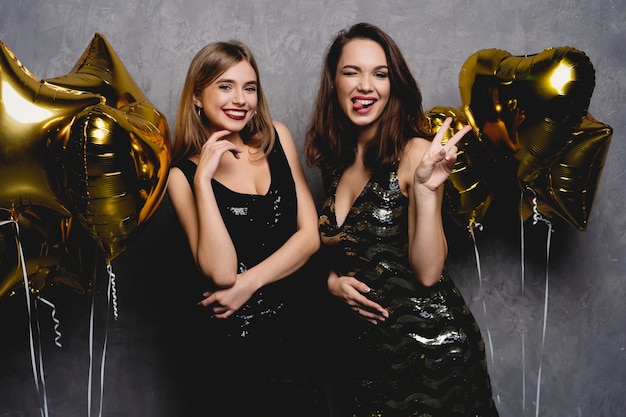 Party Fun. Beautiful Girls Celebrating New Year. Portrait Of Gorgeous Smiling Young Women Enjoying Party Celebration, Having Fun Together. High Quality Image.