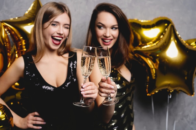 Party Fun. Beautiful Girls Celebrating New Year. Portrait Of Gorgeous Smiling Young Women Enjoying Party Celebration, Having Fun Together. High Quality Image.