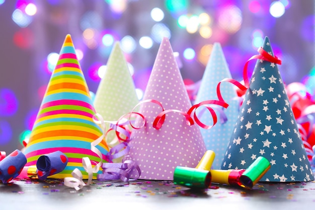 Party hats and other stuff on blurred garland background