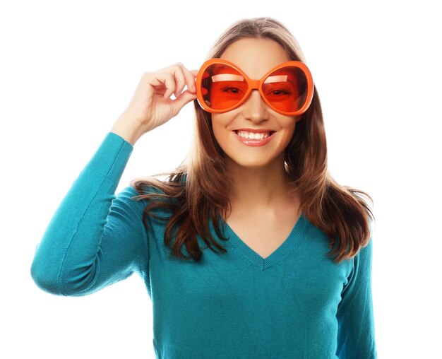 Party image Playful young woman with big party glasses Ready for good time