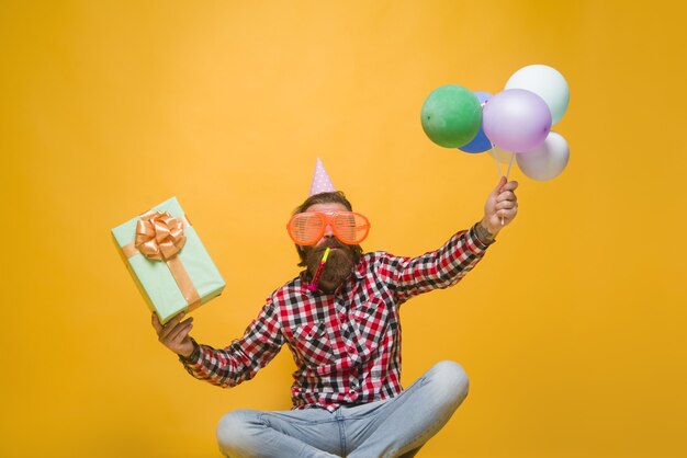 Party man holidays party celebration concept party time holidays and celebration man with balloons