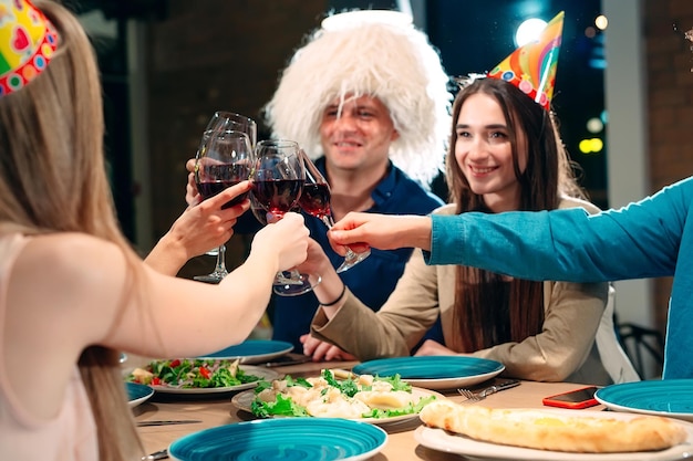 Party at a restaurant. Friends have fun in a restaurant and drink wine. festive mood.