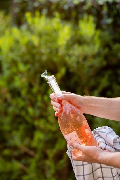 Party with a bottle of champagne Sparkling at a bottle party Sparkling pours into a glass Holiday