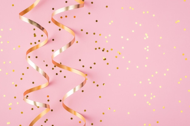 Partying concept. Top above overhead view close up photo of confetti isolated on patel pink background