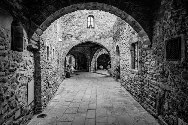 Passageways with stone arcade and medieval houses in a picturesque style and of great beauty Monells Girona Catalonia