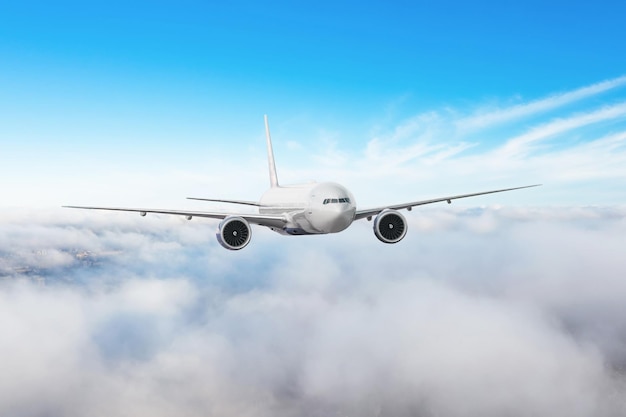 Passenger airliner flies along the edge of low stratus clouds