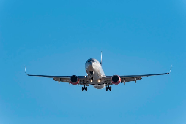 Passenger airplane on approach to the airport landing.