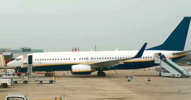 Passenger airplane with few people boarding